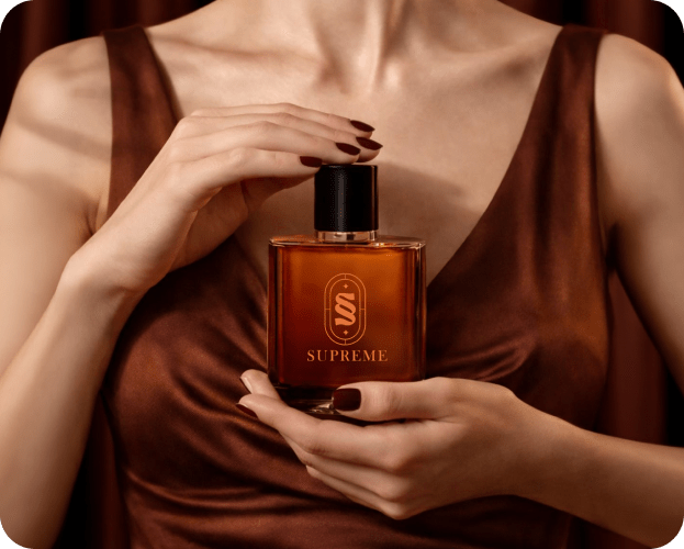Woman in brown silk dress holding Supreme perfume bottle for luxury brand campaign