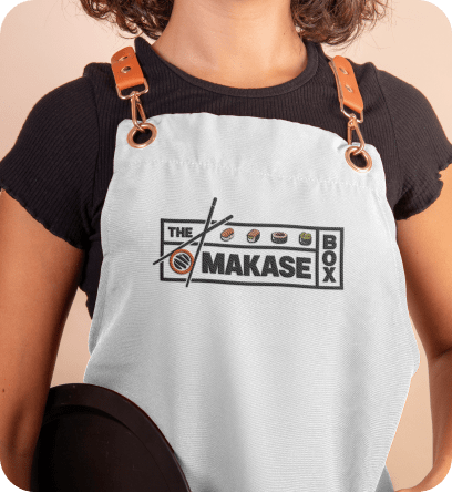Omakase Box logo on chef apron ensuring consistent brand identity